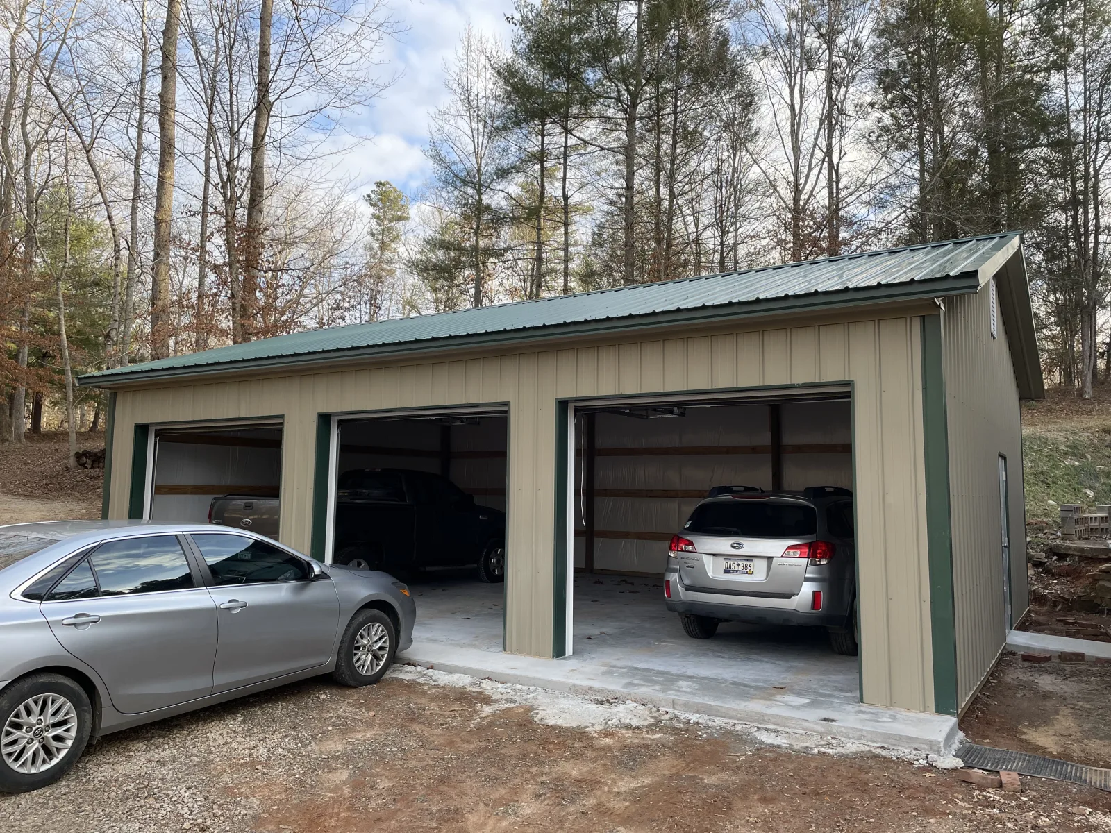 Garage and shop building with two overhead doors built by Hoover Buildings